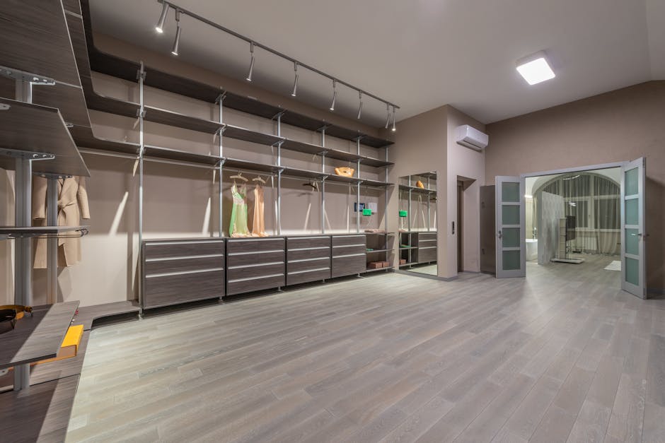 Luxury custom walk-in closet with beautiful shelving and lighting